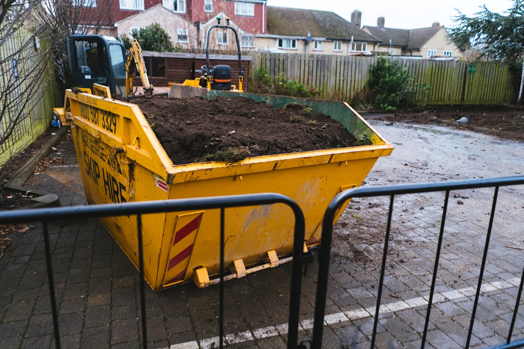 a-large-yellow-dump-truck-filled-with-dirt-ovyz1a5jhzy